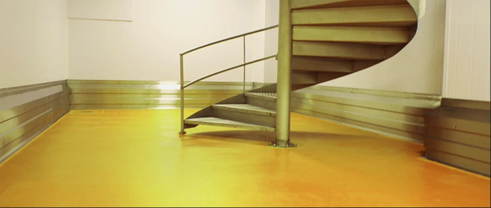 yellow floor with spiral stairs